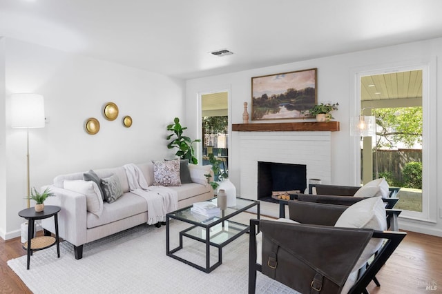 1109 Broadmoor Dr, Napa, CA 94558 - living area featuring wood finished floors and a brick fireplace