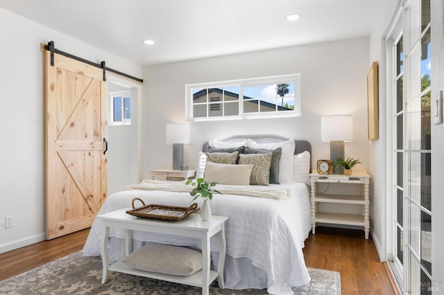 1109 Broadmoor Dr, Napa, CA 94558 - bedroom featuring a barn door, wood finished floors, multiple windows, and recessed lighting