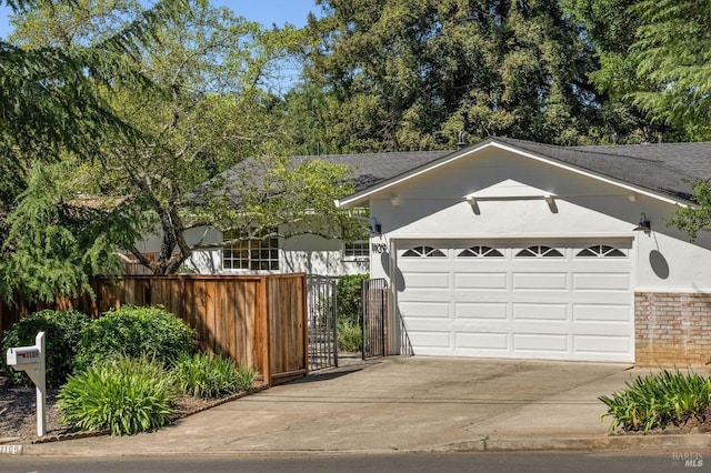 1109 Broadmoor Dr, Napa, CA 94558 - view of front of property featuring concrete driveway, an attached garage, stucco siding, and a shingled roof
