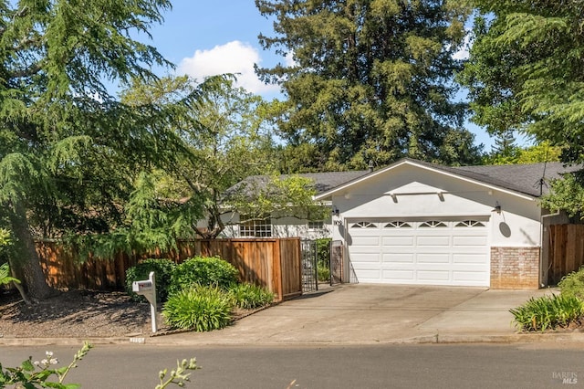 1109 Broadmoor Dr, Napa, CA 94558 - view of front of property with an attached garage, driveway, brick siding, and stucco siding