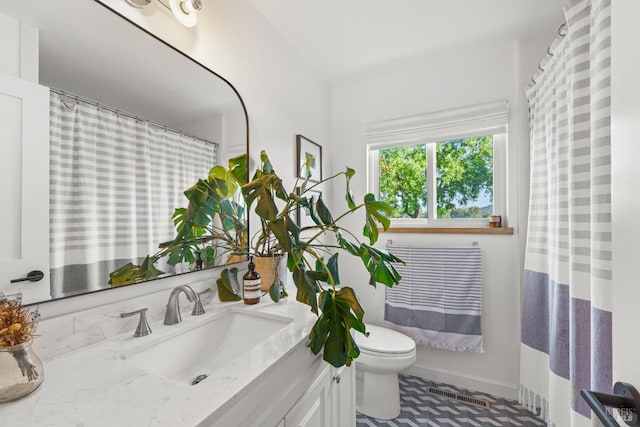 21800 River Rd, Geyserville, CA 95441 - bathroom with toilet, vanity, and baseboards