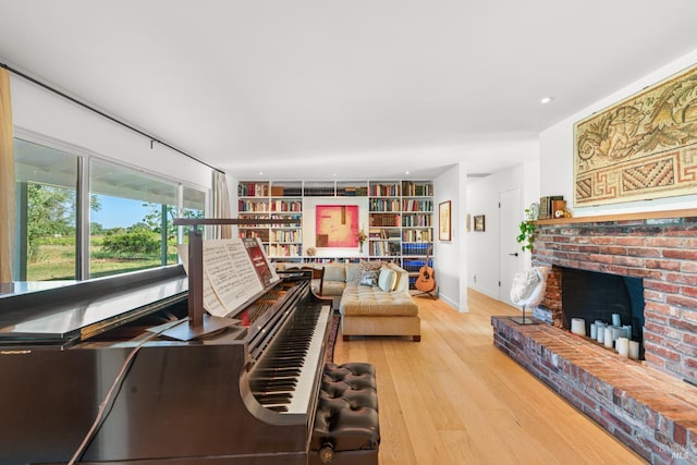 21800 River Rd, Geyserville, CA 95441 - living area featuring light wood-style floors, a fireplace, and built in features