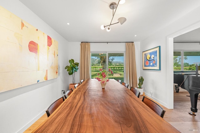 21800 River Rd, Geyserville, CA 95441 - dining area featuring plenty of natural light, wood finished floors, baseboards, recessed lighting, and a chandelier