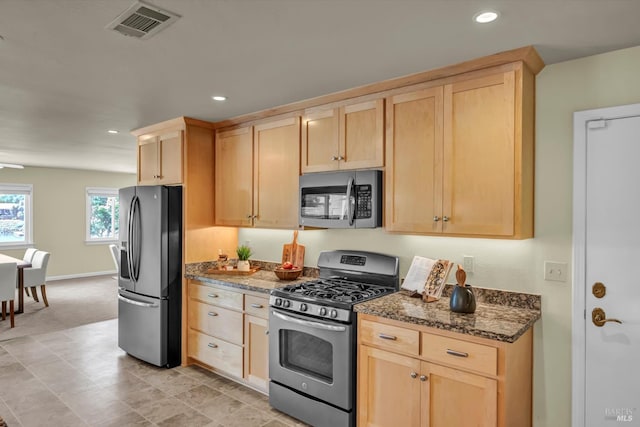 687 Cabot Way, Napa, CA 94559 - kitchen with stainless steel appliances, light brown cabinets, dark stone counters, recessed lighting, and light colored carpet