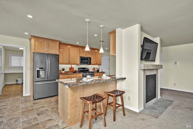 687 Cabot Way, Napa, CA 94559 - kitchen with stainless steel appliances, baseboards, dark stone counters, a peninsula, and recessed lighting