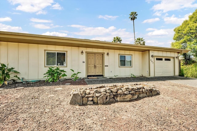 687 Cabot Way, Napa, CA 94559 - ranch-style house featuring board and batten siding, an attached garage, and driveway
