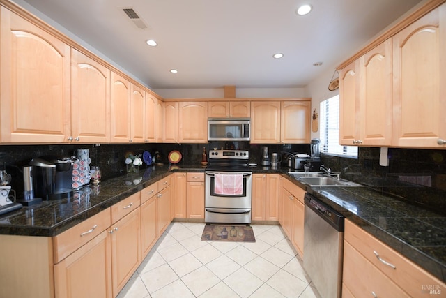 433 Freeway Dr, Napa, CA 94558 - kitchen with stainless steel appliances, light brown cabinets, a sink, recessed lighting, and decorative backsplash