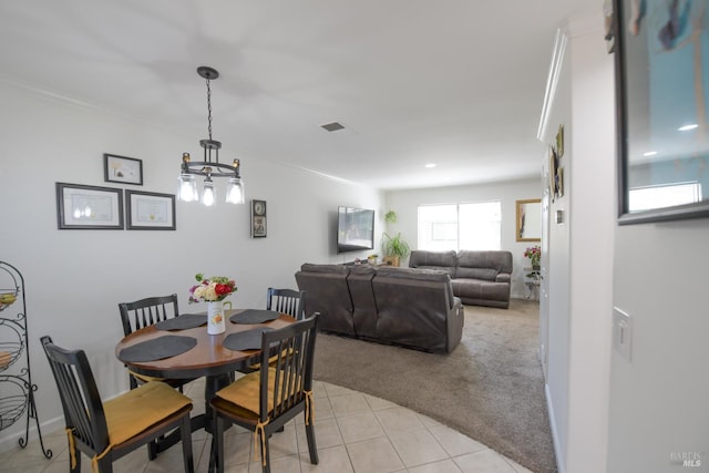 433 Freeway Dr, Napa, CA 94558 - dining room with light tile patterned floors, a chandelier, light carpet, and crown molding