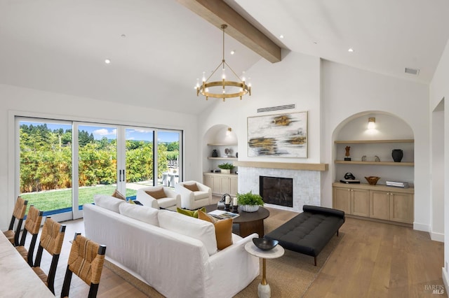 1597 Arrowhead Dr, Saint Helena, CA 94574 - living area featuring built in shelves, beamed ceiling, a fireplace, high vaulted ceiling, and a chandelier