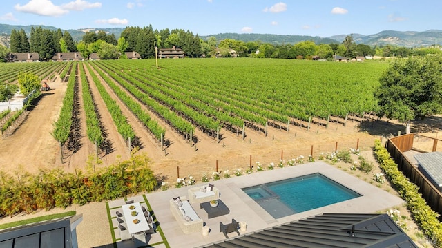 1597 Arrowhead Dr, Saint Helena, CA 94574 - overview of rural landscape featuring rows of crops, a mountainous background, and a pool area