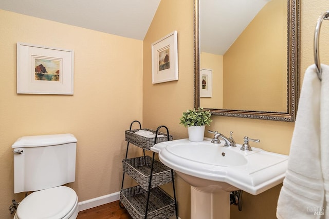 4 San Pablo Ct, Novato, CA 94949 - bathroom with lofted ceiling, toilet, wood finished floors, and baseboards