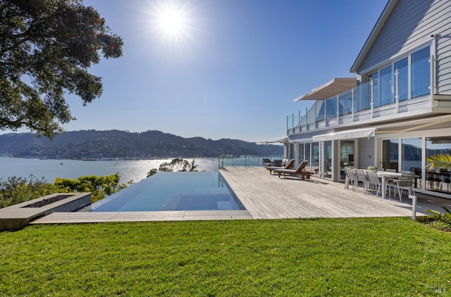 22 Eucalyptus Rd, Belvedere, CA 94920 - view of pool with a yard, an infinity pool, and a deck with water view