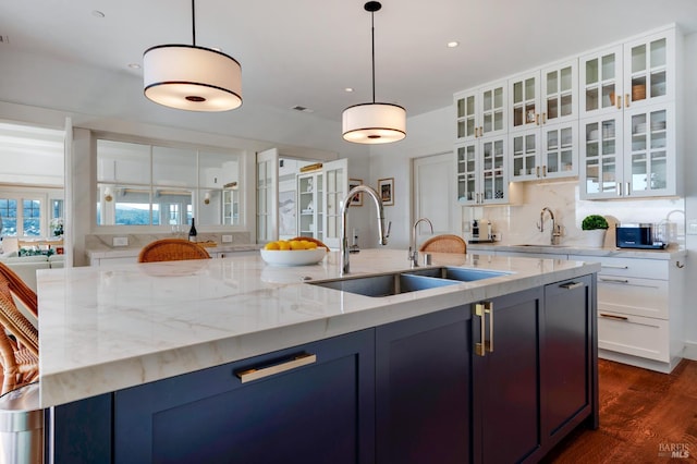 22 Eucalyptus Rd, Belvedere, CA 94920 - kitchen featuring a sink, backsplash, white cabinetry, light stone countertops, and recessed lighting