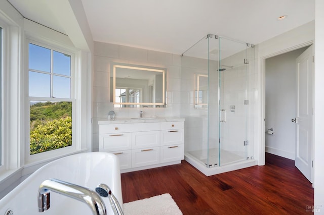 22 Eucalyptus Rd, Belvedere, CA 94920 - full bath with a shower stall, a freestanding tub, vanity, and wood finished floors