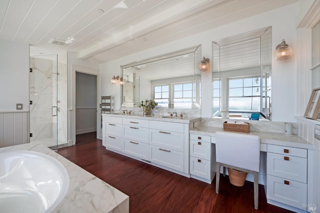 22 Eucalyptus Rd, Belvedere, CA 94920 - bathroom featuring a marble finish shower, wood finished floors, wainscoting, a bathtub, and vanity