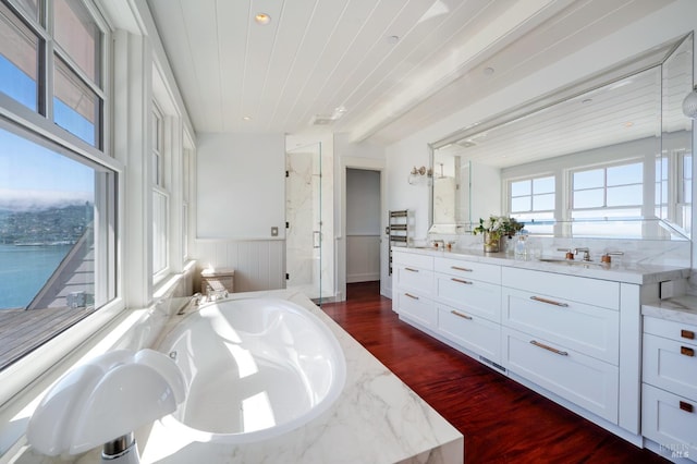 22 Eucalyptus Rd, Belvedere, CA 94920 - bathroom featuring a marble finish shower, a bath, wood finished floors, vanity, and a wainscoted wall
