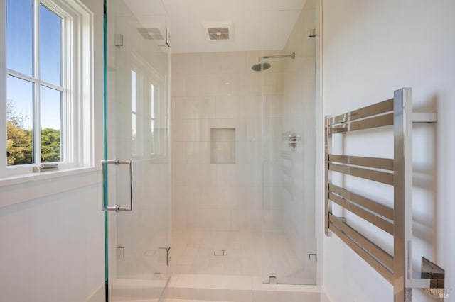 22 Eucalyptus Rd, Belvedere, CA 94920 - full bathroom with a shower stall, radiator, and baseboards