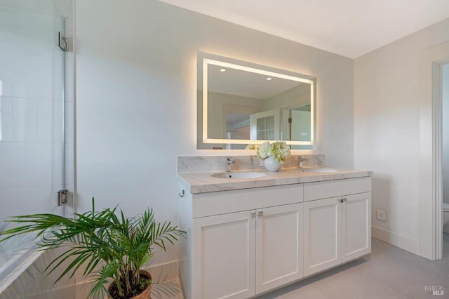 22 Eucalyptus Rd, Belvedere, CA 94920 - full bath with a stall shower, double vanity, toilet, tile patterned flooring, and baseboards