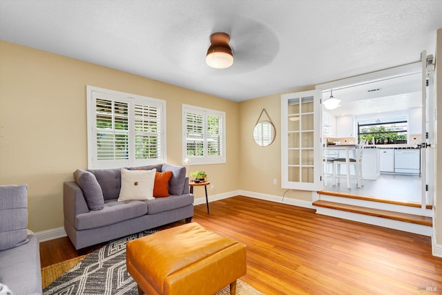 632 E K St, Benicia, CA 94510 - living room with light wood-style flooring and baseboards