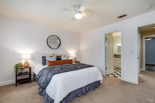 632 E K St, Benicia, CA 94510 - bedroom featuring light carpet, baseboards, ensuite bath, and ceiling fan