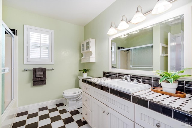 632 E K St, Benicia, CA 94510 - full bath featuring tile patterned floors, an enclosed shower, vanity, toilet, and baseboards