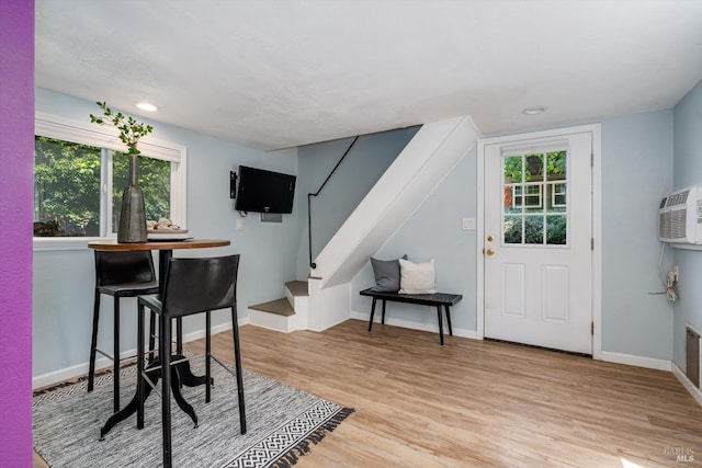 632 E K St, Benicia, CA 94510 - dining room with wood finished floors, stairs, baseboards, an AC wall unit, and recessed lighting