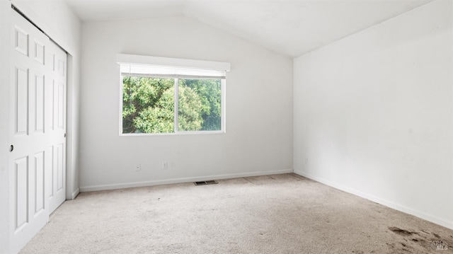 1191 Araquipa Ct, Vacaville, CA 95687 - unfurnished bedroom with carpet, lofted ceiling, a closet, and baseboards