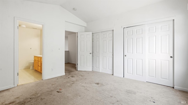1191 Araquipa Ct, Vacaville, CA 95687 - unfurnished bedroom with two closets, carpet flooring, vaulted ceiling, ensuite bathroom, and baseboards