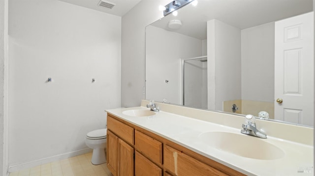 1191 Araquipa Ct, Vacaville, CA 95687 - bathroom featuring a stall shower, double vanity, toilet, baseboards, and tile patterned floors