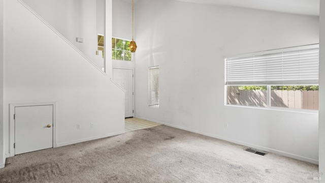 1191 Araquipa Ct, Vacaville, CA 95687 - unfurnished living room with high vaulted ceiling, carpet floors, and baseboards