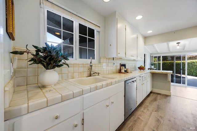 22 Laurie Ct, Novato, CA 94947 - kitchen featuring dishwasher, a sink, light wood finished floors, white cabinets, and backsplash