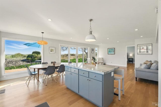 8 Rafael Patio, Stinson Beach, CA 94970 - kitchen with a kitchen island, light wood-style floors, recessed lighting, open floor plan, and decorative light fixtures