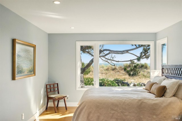 8 Rafael Patio, Stinson Beach, CA 94970 - bedroom featuring wood finished floors, recessed lighting, baseboards, and access to exterior