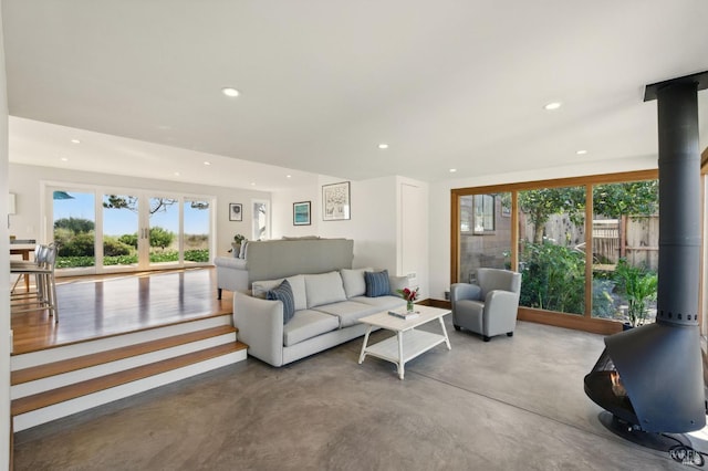 8 Rafael Patio, Stinson Beach, CA 94970 - living area featuring a wood stove, concrete flooring, and recessed lighting