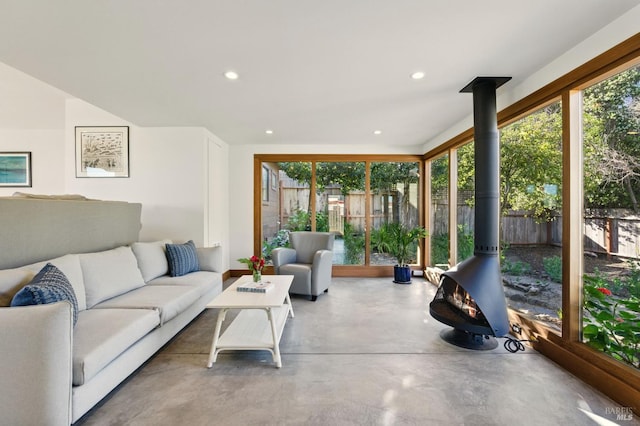 8 Rafael Patio, Stinson Beach, CA 94970 - living area featuring a wood stove, healthy amount of natural light, concrete floors, and recessed lighting