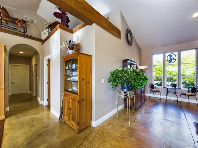 7785 Torgersen Rd, Eureka, CA 95503 - corridor with concrete floors, arched walkways, baseboards, and high vaulted ceiling
