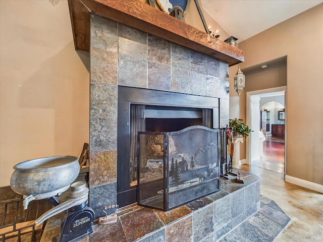 7785 Torgersen Rd, Eureka, CA 95503 - detailed view of a tile fireplace, concrete flooring, and baseboards