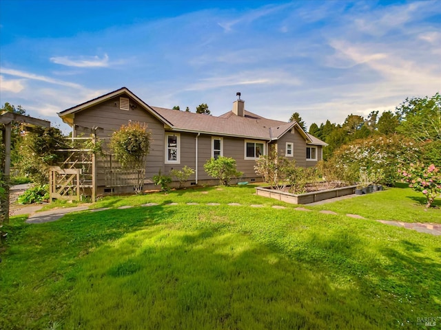 7785 Torgersen Rd, Eureka, CA 95503 - rear view of house featuring a vegetable garden, a yard, a chimney, and crawl space