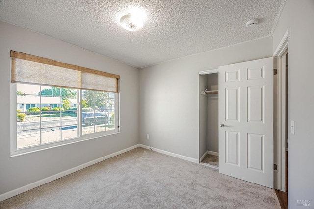 1181 Eleanor Ave, Rohnert Park, CA 94928 - unfurnished bedroom featuring a textured ceiling, carpet flooring, a closet, and baseboards