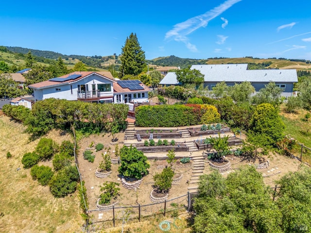 12 Maidu Ct, Napa, CA 94558 - back of property with roof mounted solar panels, stairway, and a deck with mountain view