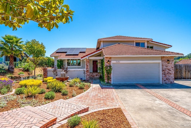 12 Maidu Ct, Napa, CA 94558 - view of front of property with a tile roof, driveway, roof mounted solar panels, a garage, and stucco siding