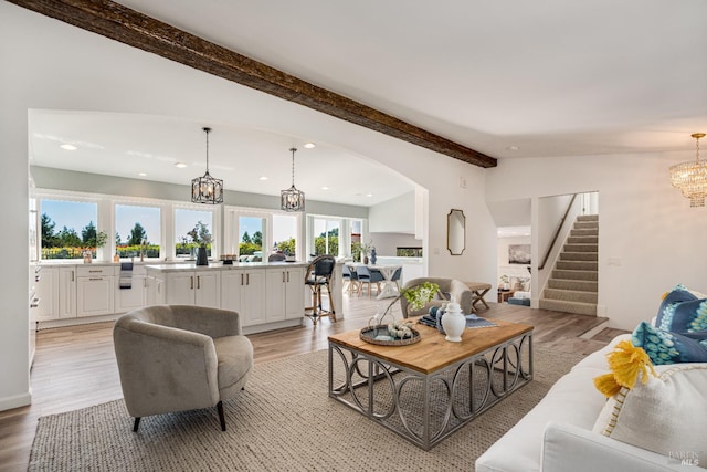 12 Maidu Ct, Napa, CA 94558 - living room with a chandelier, stairs, recessed lighting, arched walkways, and light wood-style flooring