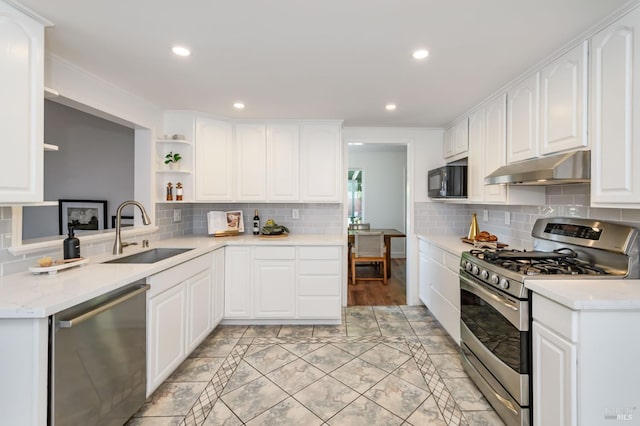 914 Cottonwood Ct, Petaluma, CA 94954 - kitchen featuring stainless steel appliances, a sink, under cabinet range hood, open shelves, and light countertops