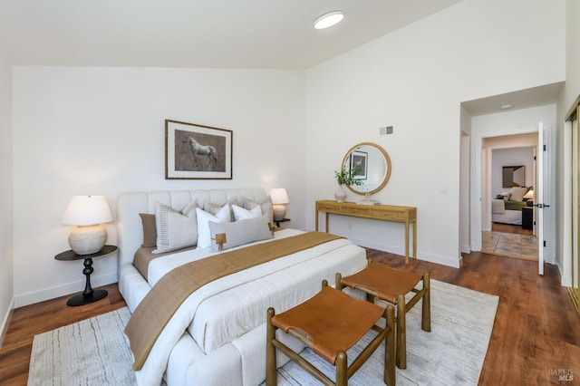 914 Cottonwood Ct, Petaluma, CA 94954 - bedroom featuring baseboards, wood finished floors, and lofted ceiling