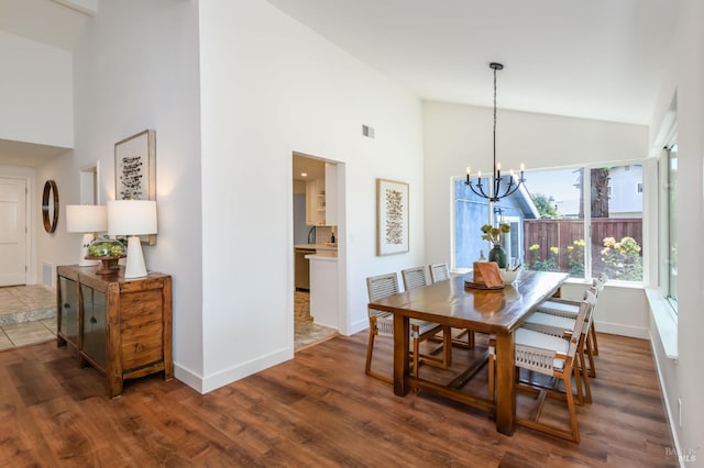 914 Cottonwood Ct, Petaluma, CA 94954 - dining area featuring a chandelier, high vaulted ceiling, baseboards, and wood finished floors