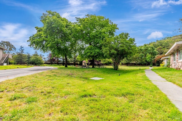 64 Los Padres Cir, Novato, CA 94947 - view of grassy yard featuring a playground