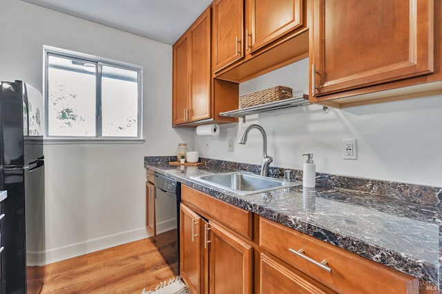 64 Los Padres Cir, Novato, CA 94947 - kitchen with a sink, black appliances, light wood-style flooring, brown cabinetry, and baseboards