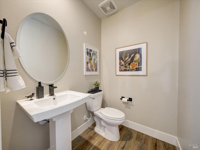 226 Verandah Ave, Novato, CA 94945 - bathroom featuring wood finished floors, toilet, and baseboards