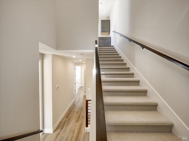 226 Verandah Ave, Novato, CA 94945 - staircase featuring wood finished floors, a high ceiling, and baseboards