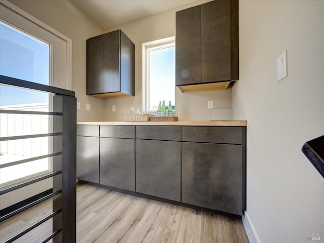 226 Verandah Ave, Novato, CA 94945 - kitchen with light wood-style floors, dark brown cabinetry, and light countertops